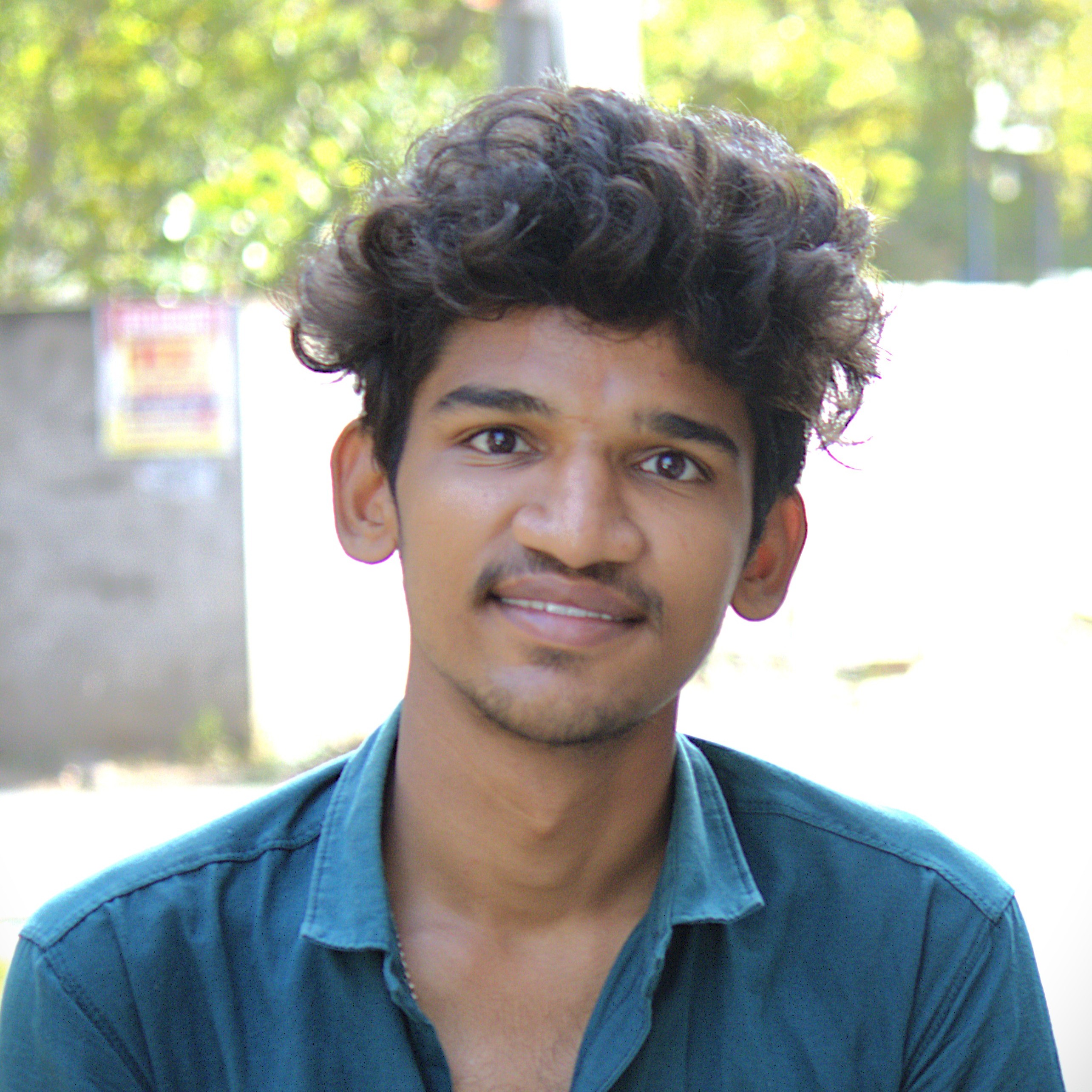 A headshot of Sai Kumar
